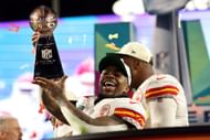 Jerick McKinnon of the Kansas City Chiefs celebrates with the Vince Lombardi Trophy.